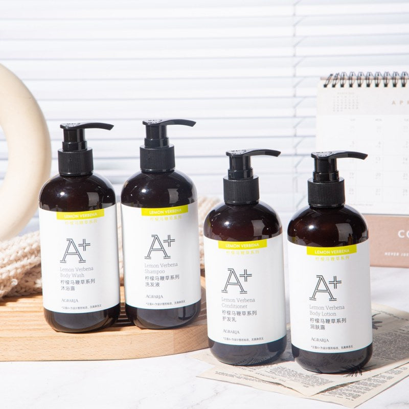 four bottles of AGRARIA hotel toiletries displayed on the tray.