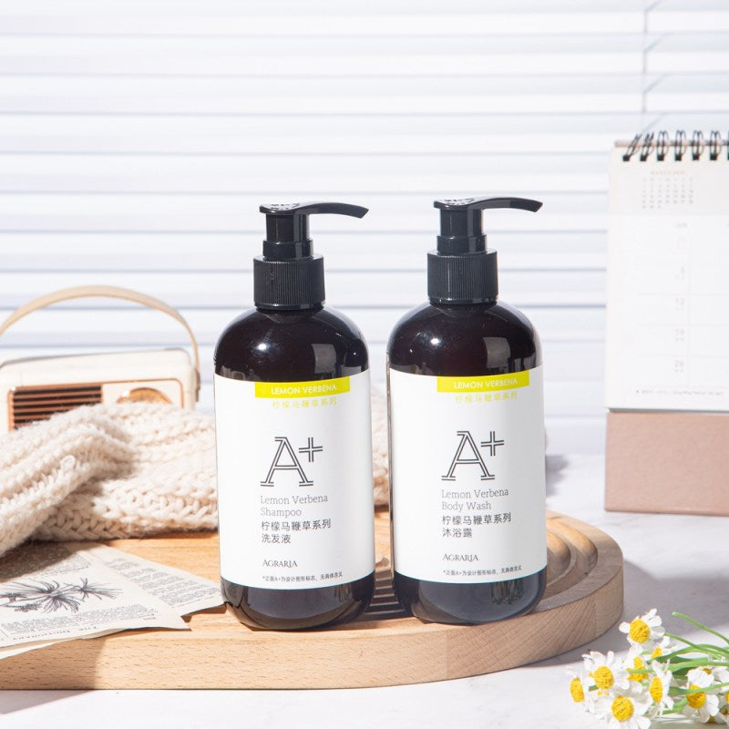 two bottles of AGRARIA hotel shampoo and shower gel displayed on the tray.