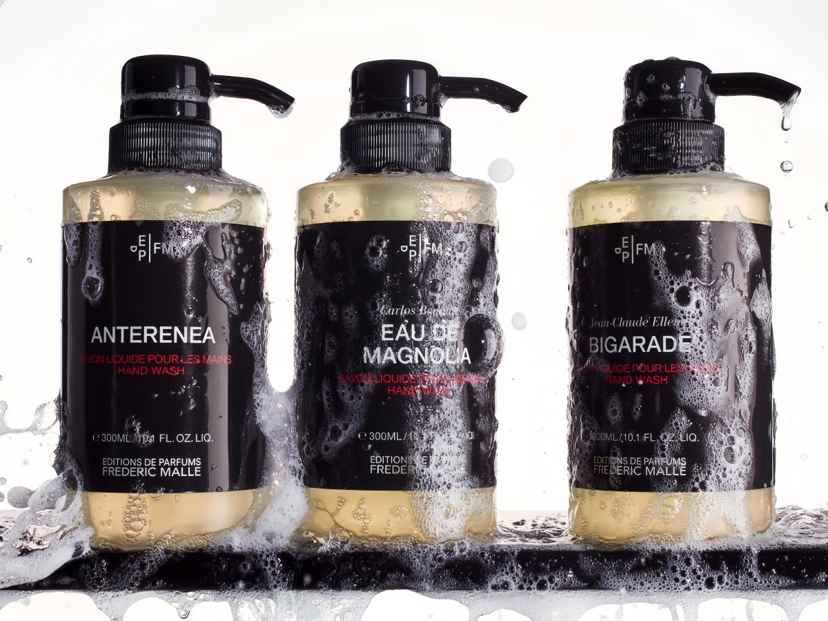 3 bottles of EAU-DE-MAGNOLIA hand wash placed on a tray, the bottles are very rich in foam.