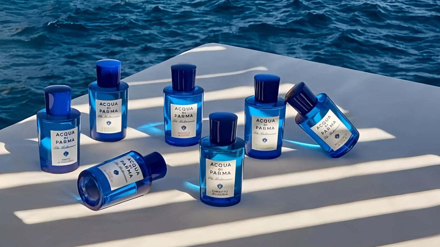 With the sea as the background, 7 bottles of acqua di parma are displayed, highlighting the Mediterranean theme