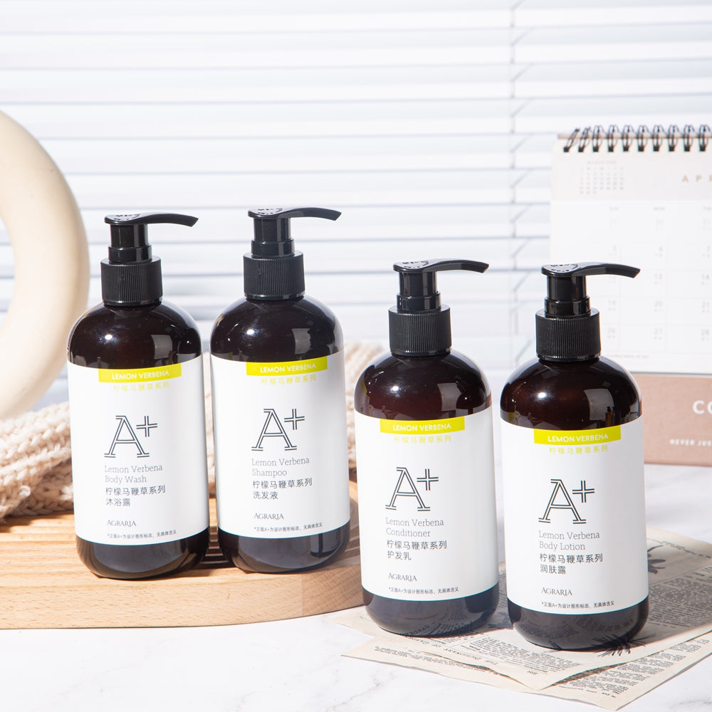 four bottles of AGRARIA hotel toiletries displayed on the tray.