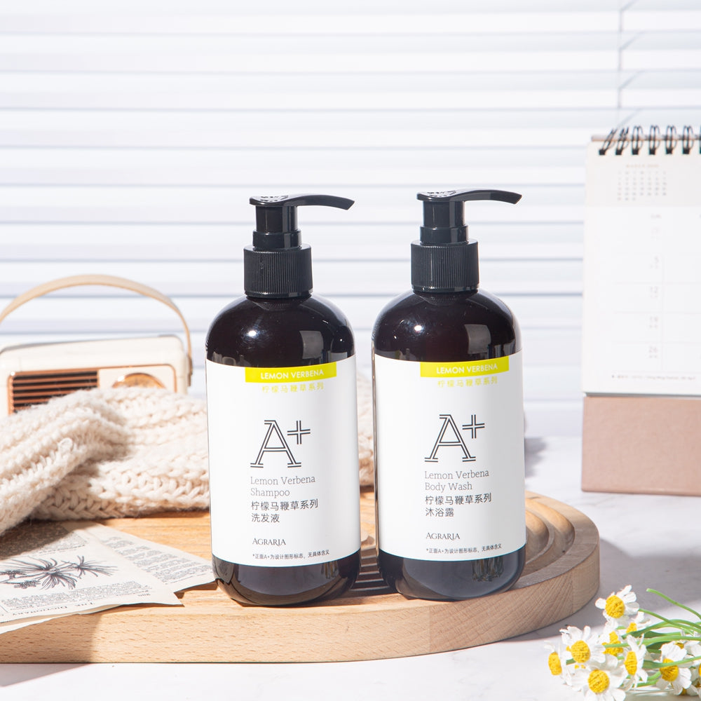 two bottles of AGRARIA hotel shampoo and shower gel displayed on the tray.