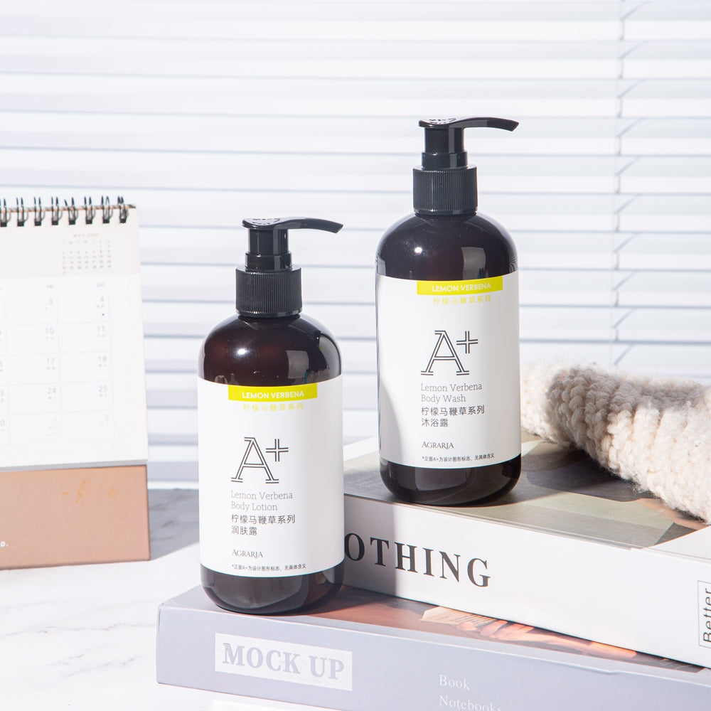 two bottles of AGRARIA hotel shower gel and body lotion displayed on the tray.