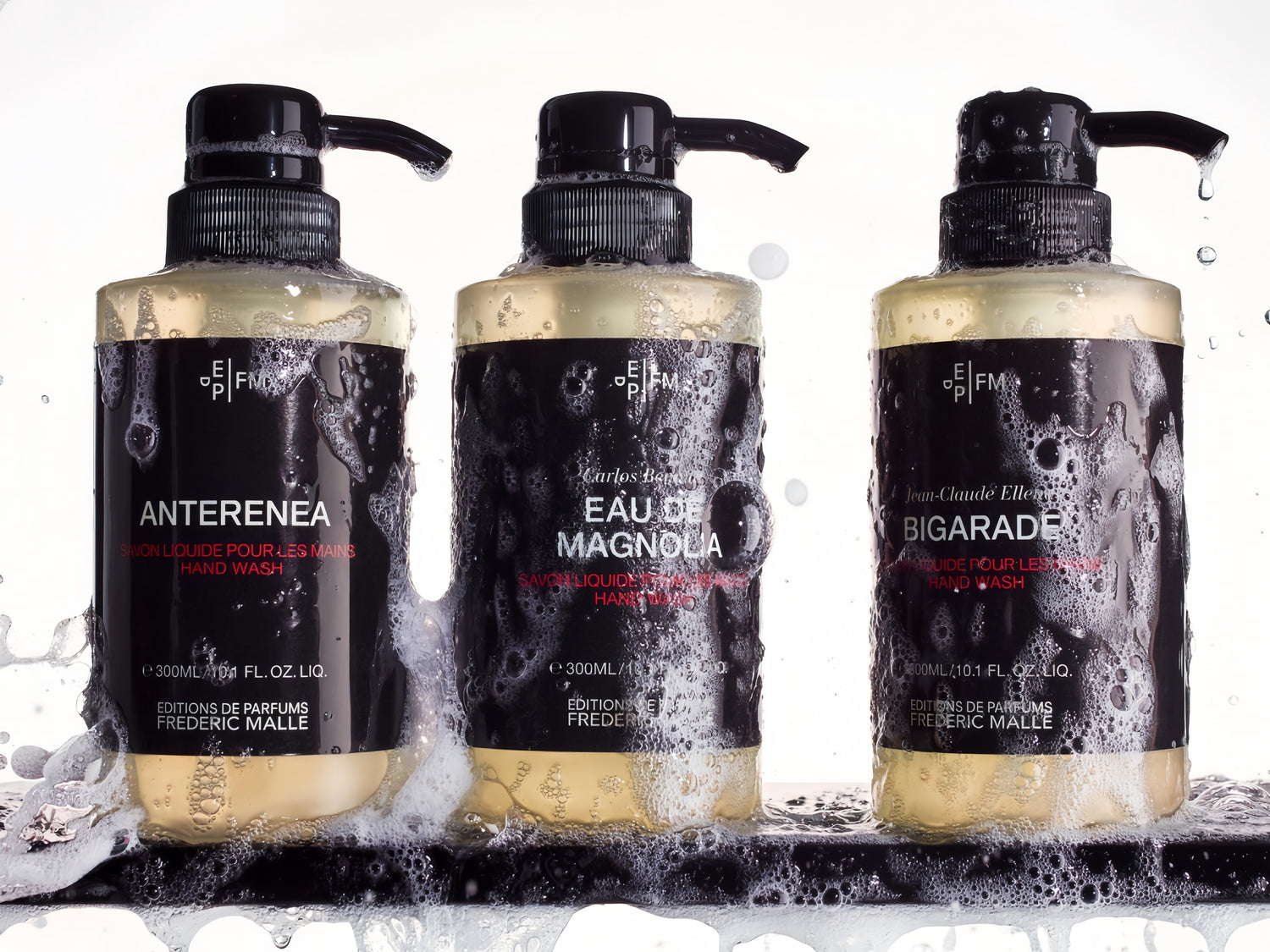 3 bottles of EAU-DE-MAGNOLIA hand wash placed on a tray, the bottles are very rich in foam.